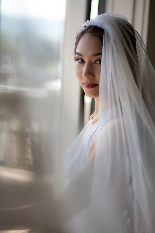 Portrait shot of a bride with her veil by Kellie Foster Photography and Spark Boudoir.